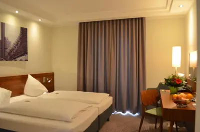Ein Bett oder Betten in einem Zimmer der Unterkunft Augusten Hotel München