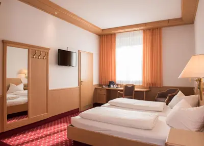 Ein Bett oder Betten in einem Zimmer der Unterkunft Hotel und Gasthof Soller