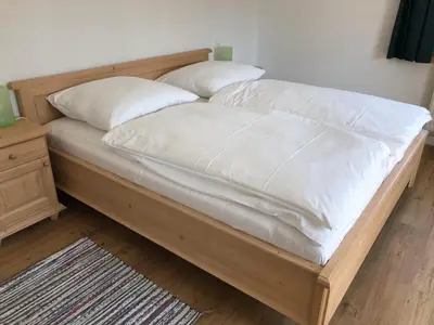 Ein Bett oder Betten in einem Zimmer der Unterkunft Landgasthaus zum Altwirt Reichersbeuern