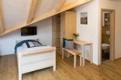 Ein Bett oder Betten in einem Zimmer der Unterkunft Pension Baumgartner