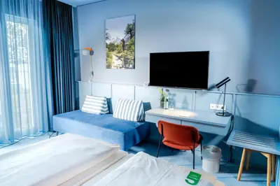 Ein Bett oder Betten in einem Zimmer der Unterkunft Stay2Munich Hotel & Serviced Apartments