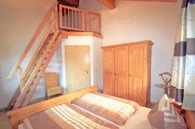 Ein Bett oder Betten in einem Zimmer der Unterkunft Ferienwohnungen Bergerhof Zuhaus