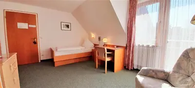 Ein Bett oder Betten in einem Zimmer der Unterkunft Hotel Seemüller