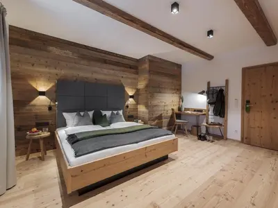 Ein Bett oder Betten in einem Zimmer der Unterkunft Forstnerwirt hotel | stubn | biergarten