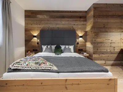 Ein Bett oder Betten in einem Zimmer der Unterkunft Forstnerwirt hotel | stubn | biergarten