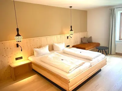 Ein Bett oder Betten in einem Zimmer der Unterkunft Forstnerwirt hotel | stubn | biergarten