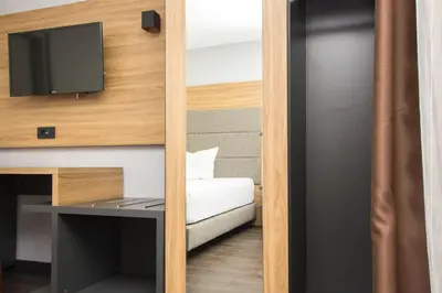 Ein Bett oder Betten in einem Zimmer der Unterkunft Hotel am See