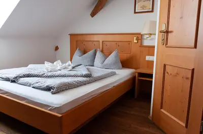 Ein Bett oder Betten in einem Zimmer der Unterkunft Landhotel & Gasthof Baiernrain