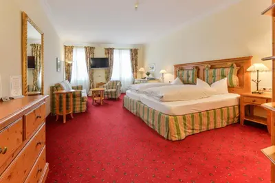 Ein Bett oder Betten in einem Zimmer der Unterkunft Hotel Post Murnau