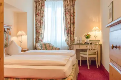 Ein Bett oder Betten in einem Zimmer der Unterkunft Hotel Post Murnau