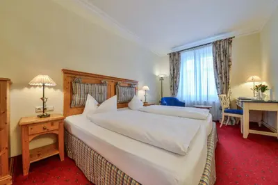 Ein Bett oder Betten in einem Zimmer der Unterkunft Hotel Post Murnau