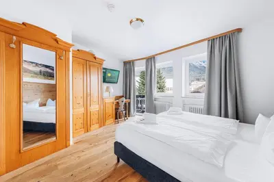 Ein Bett oder Betten in einem Zimmer der Unterkunft Weidegg - Hotel Garni