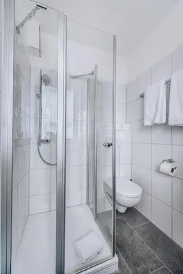 Ein Badezimmer in der Unterkunft Weidegg - Hotel Garni