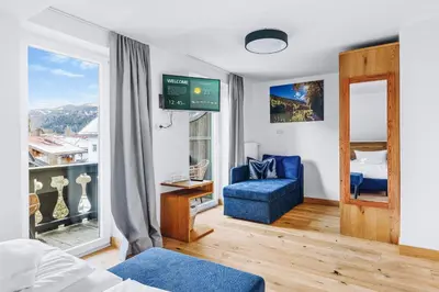 Ein Bett oder Betten in einem Zimmer der Unterkunft Weidegg - Hotel Garni