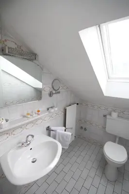 Ein Badezimmer in der Unterkunft Weidegg - Hotel Garni