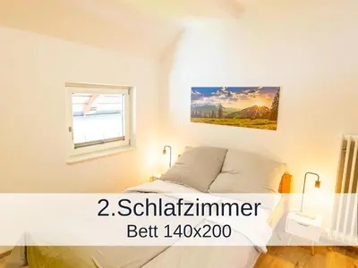 Ein Bett oder Betten in einem Zimmer der Unterkunft Ferienwohnung Rambold Sonnenterrasse