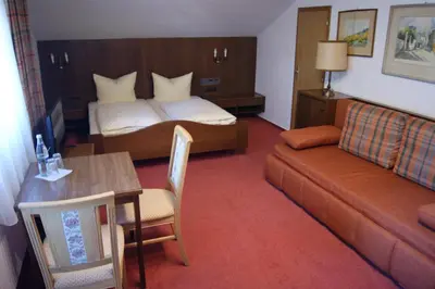Ein Bett oder Betten in einem Zimmer der Unterkunft Gästehaus Charlotte