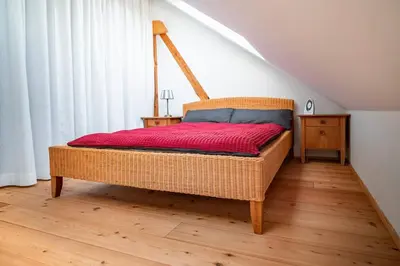 Ein Bett oder Betten in einem Zimmer der Unterkunft Roger`s Ferienwohnung