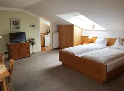 Ein Bett oder Betten in einem Zimmer der Unterkunft Gästehaus Bauer am Golfplatz