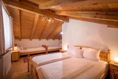Ein Bett oder Betten in einem Zimmer der Unterkunft Großhuberhof