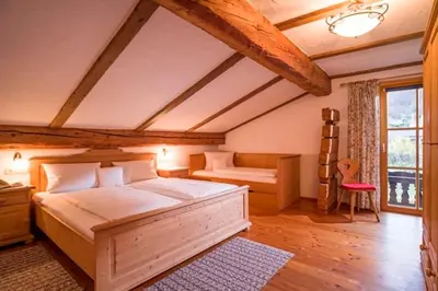 Ein Bett oder Betten in einem Zimmer der Unterkunft Großhuberhof