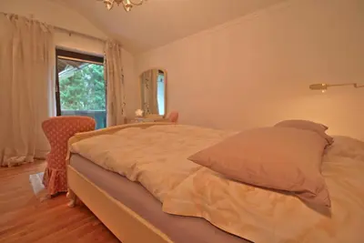 Ein Bett oder Betten in einem Zimmer der Unterkunft FeWo Alpspitz