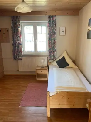 Ein Bett oder Betten in einem Zimmer der Unterkunft Pension Elisa