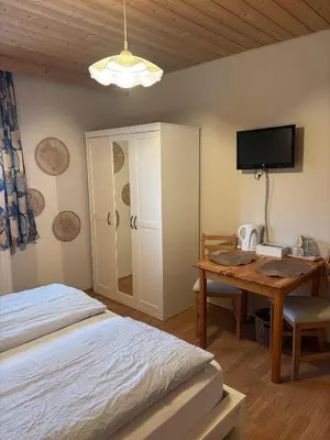 Ein Bett oder Betten in einem Zimmer der Unterkunft Pension Elisa
