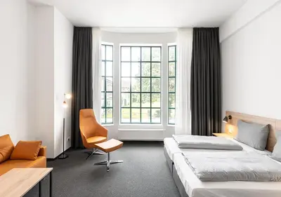 Ein Bett oder Betten in einem Zimmer der Unterkunft Apartimo Landshut