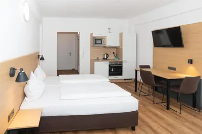 Ein Bett oder Betten in einem Zimmer der Unterkunft Apartimo Landshut