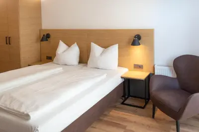 Ein Bett oder Betten in einem Zimmer der Unterkunft Apartimo Landshut