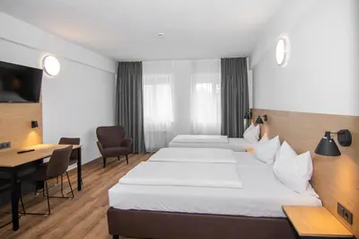 Ein Bett oder Betten in einem Zimmer der Unterkunft Apartimo Landshut