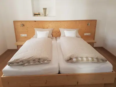 Ein Bett oder Betten in einem Zimmer der Unterkunft Ferienwohnungen Garhammer, Kreuth-Glashütte
