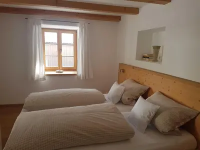 Ein Bett oder Betten in einem Zimmer der Unterkunft Ferienwohnungen Garhammer, Kreuth-Glashütte