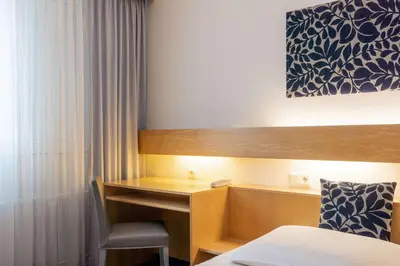 Ein Bett oder Betten in einem Zimmer der Unterkunft Comfort Hotel Atlantic Muenchen Sued