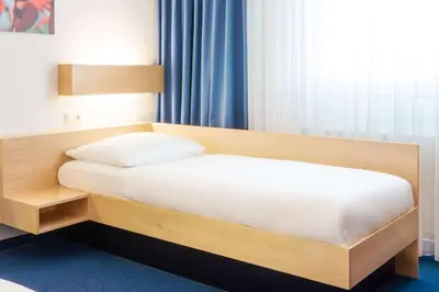 Ein Bett oder Betten in einem Zimmer der Unterkunft Comfort Hotel Atlantic Muenchen Sued