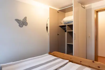 Ein Bett oder Betten in einem Zimmer der Unterkunft Ferienwohnung Schießl
