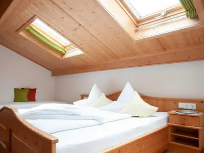 Ein Bett oder Betten in einem Zimmer der Unterkunft Gästehaus Webermohof