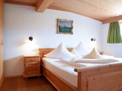 Ein Bett oder Betten in einem Zimmer der Unterkunft Gästehaus Webermohof