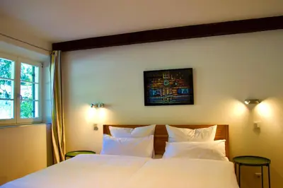 Ein Bett oder Betten in einem Zimmer der Unterkunft Spitzing Lodge Ferienwohnungen - Wanderparadies in den Bergen