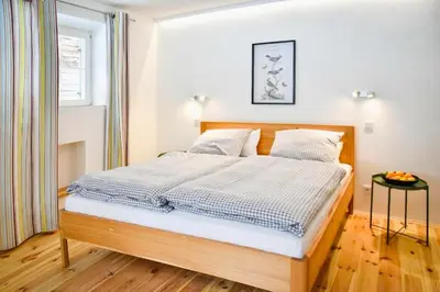 Ein Bett oder Betten in einem Zimmer der Unterkunft Spitzing Lodge Ferienwohnungen - Wanderparadies in den Bergen