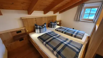 Ein Bett oder Betten in einem Zimmer der Unterkunft Der Anderlbauer am See