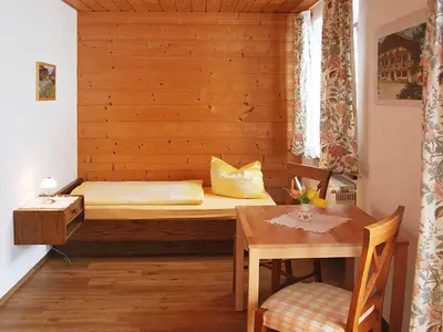 Ein Bett oder Betten in einem Zimmer der Unterkunft Der Anderlbauer am See