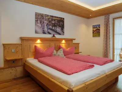 Ein Bett oder Betten in einem Zimmer der Unterkunft Der Anderlbauer am See