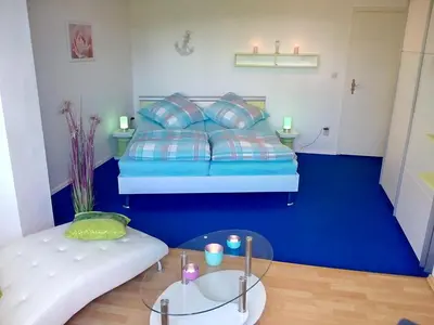 Ein Bett oder Betten in einem Zimmer der Unterkunft Sonnenoase am Dachsberg zwischen München, Tegernsee, Chiemsee, Messe München