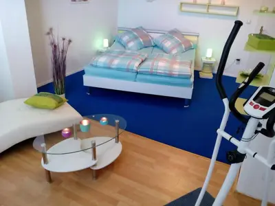 Ein Bett oder Betten in einem Zimmer der Unterkunft Sonnenoase am Dachsberg zwischen München, Tegernsee, Chiemsee, Messe München