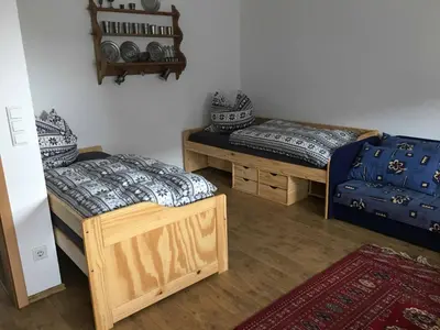 Ein Bett oder Betten in einem Zimmer der Unterkunft Pension zur Schmied'n