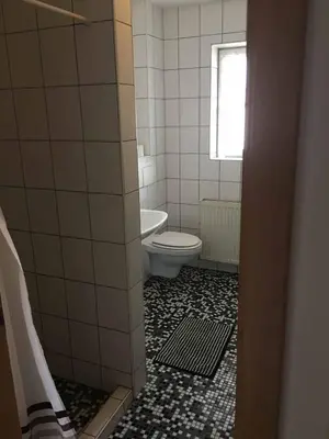 Ein Badezimmer in der Unterkunft Pension zur Schmied'n