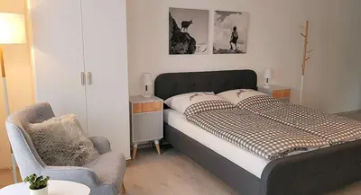 Ein Bett oder Betten in einem Zimmer der Unterkunft VILLA BERGAUF, Studio Apartment König Ludwig II Kini INKL KÖNIGSCARD !!