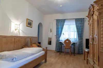 Ein Bett oder Betten in einem Zimmer der Unterkunft Fischerstüberl Attel